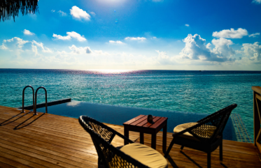 A serene overwater retreat offers breathtaking ocean views and total relaxation.