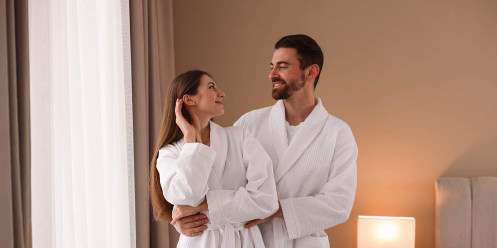 A couple enjoys a peaceful and romantic stay in a comfortable hotel room.