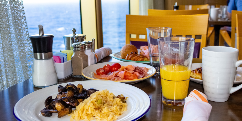 A fresh breakfast spread served with beautiful ocean views from the hotel dining area.
