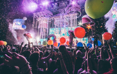 Guests dance beneath confetti and balloons during an unforgettable yacht party celebration.