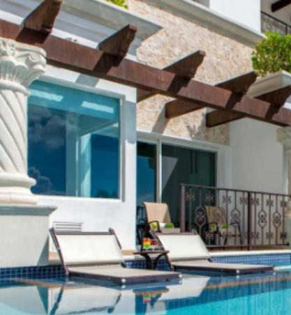 Unwind in a private poolside suite, where comfort meets elegance in a serene tropical setting.