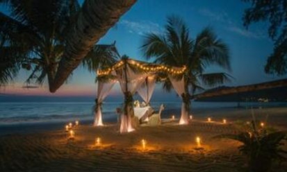 A private candlelit dinner under the stars, set on the beach for an unforgettable romantic evening.