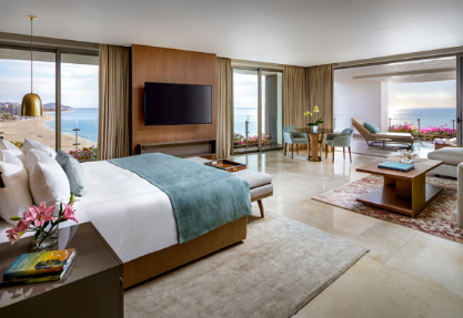 Wake up to breathtaking ocean views in a spacious luxury suite designed for comfort and elegance.
