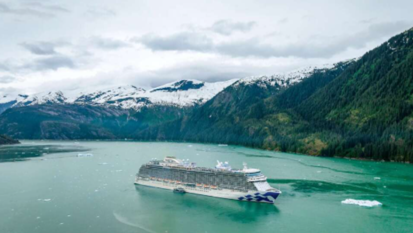 A joyful couple shares a playful and romantic moment aboard a yacht, celebrating love on the open water.