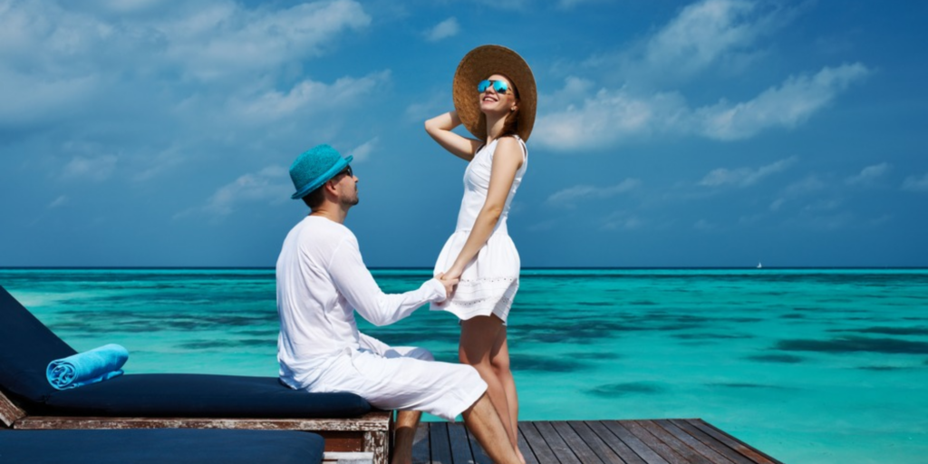 Couple enjoying a peaceful oceanfront honeymoon scene