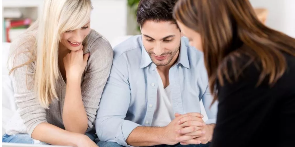 Couple with their wedding advisor
