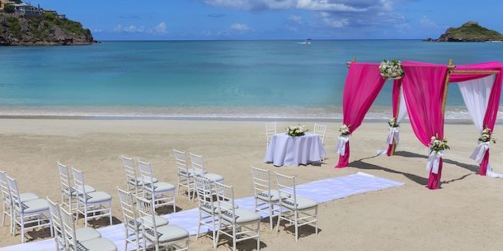 A beachfront ceremony creates a beautiful setting for an intimate destination wedding in Antigua.