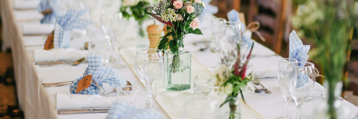 Wedding decor budget decisions shown through a reception tablescape with florals