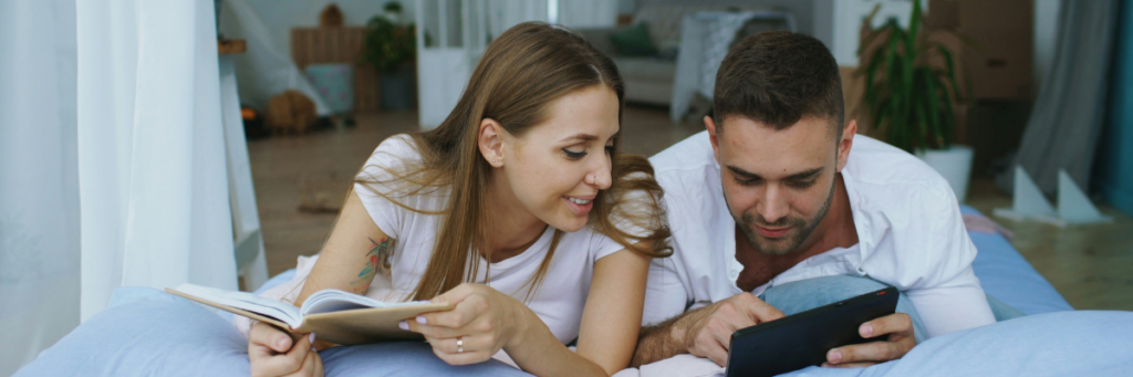 Wedding planning stress, couple reviewing timeline and vendor details together
